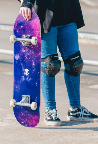 Teen holding a skateboard